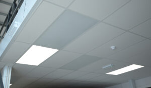 Ceiling tile heaters in office space