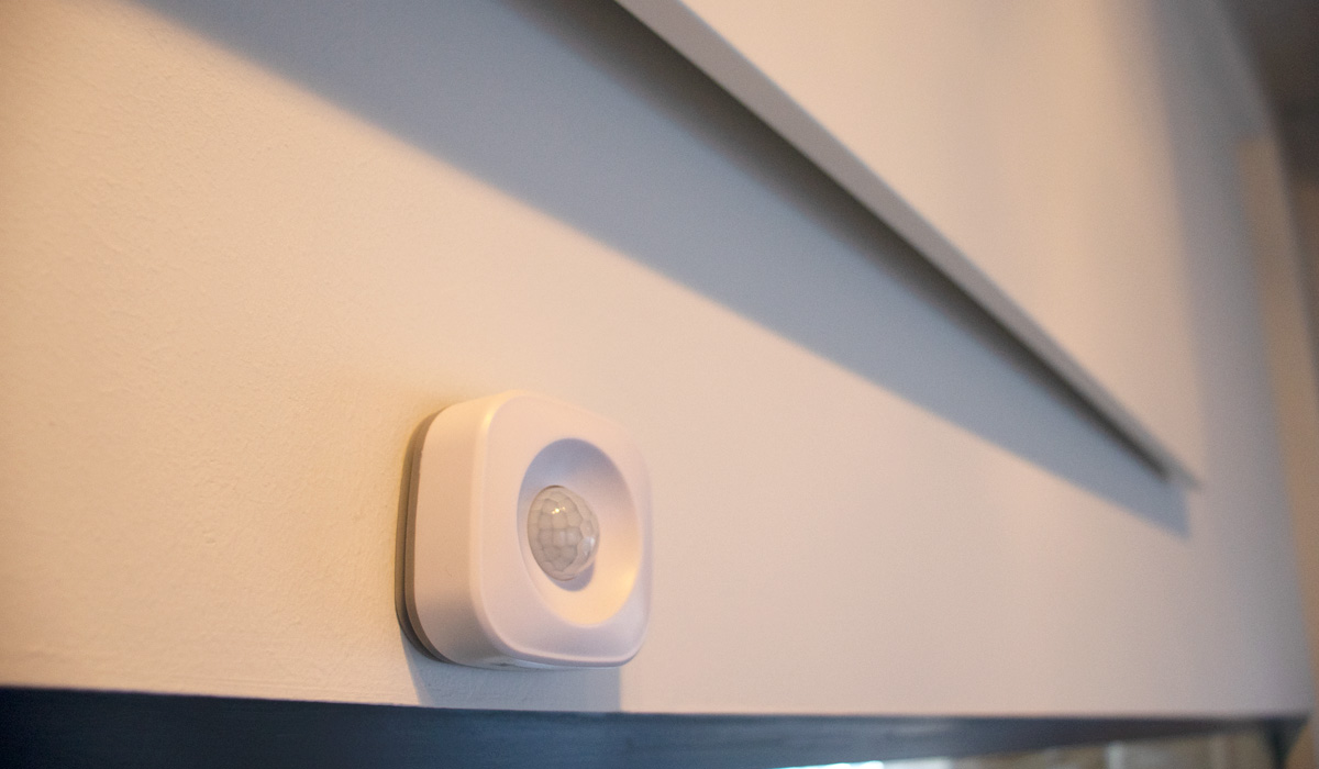 PIR Motion Sensor installed on a wall beneath the Herschel Infrared panel heater