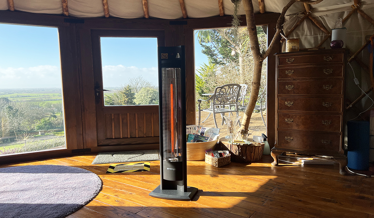 Malibu portable infrared patio heater heating a safari cabin