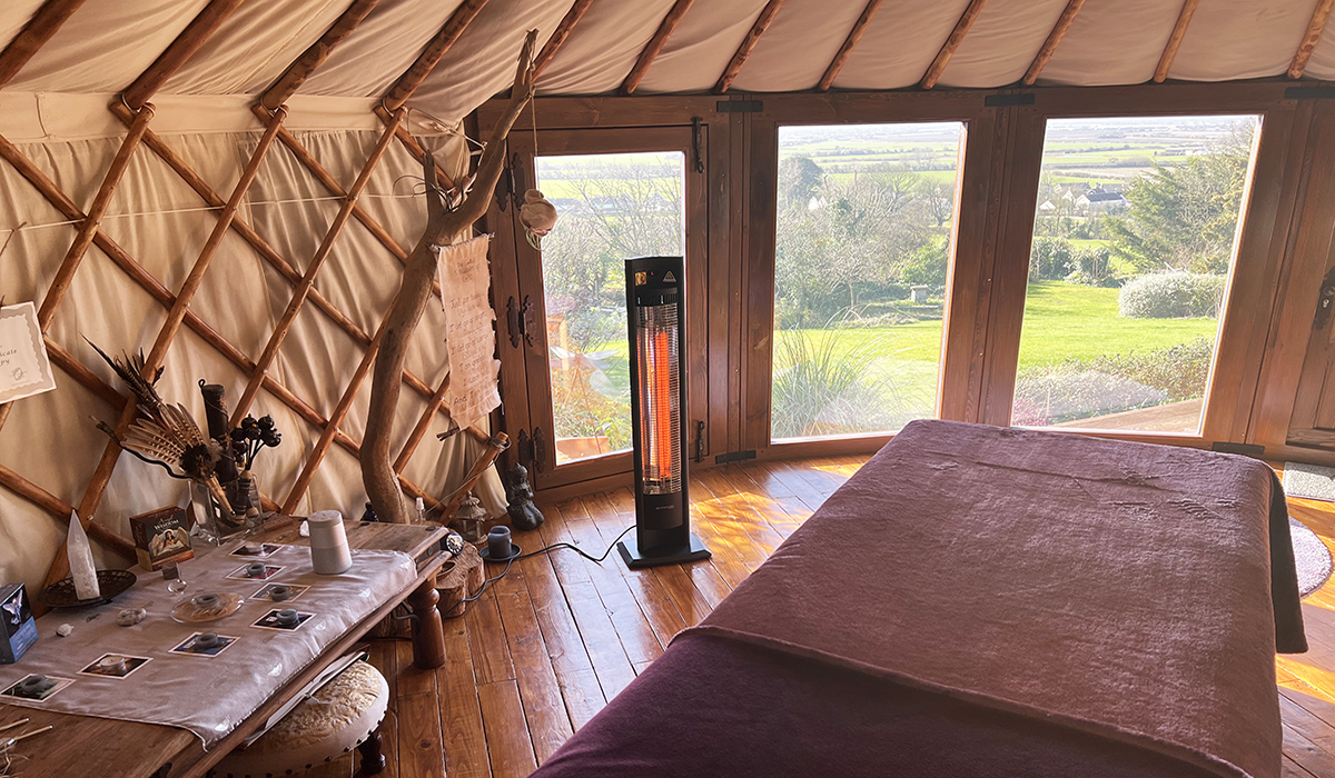 Malibu portable infrared patio heater heating a safari cabin