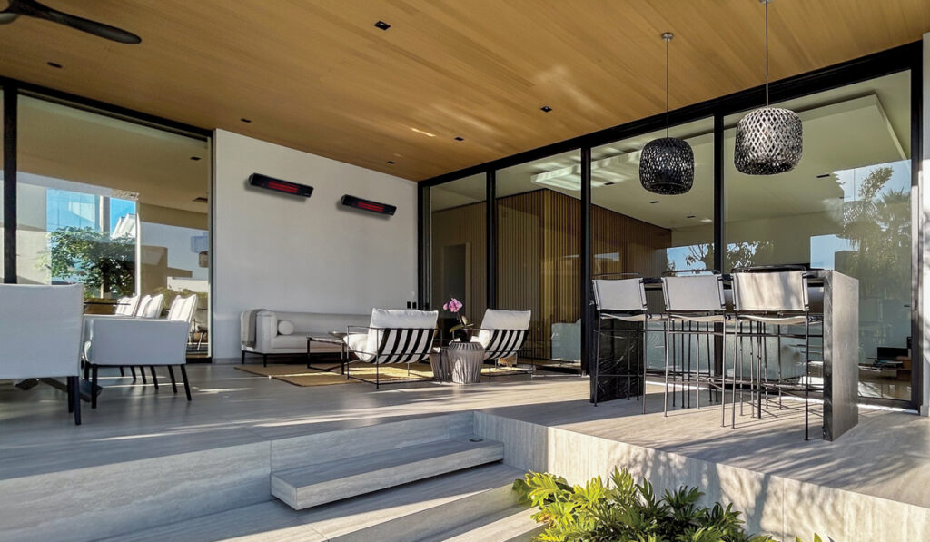 Outdoor lounge heated with Herschel Rio glass electric patio heater