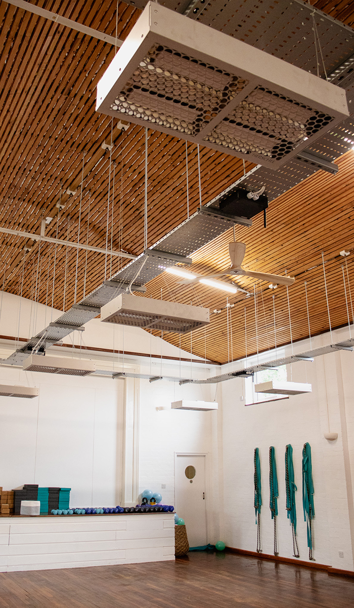 Wellness studio heated with infrared heaters to create the perfect temperature for hot yoga
