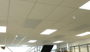 Ceiling tile heaters in warehouse office