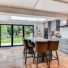 Herschel Select XLS and Inspire white frameless panel ceiling mounted in open plan kitchen area