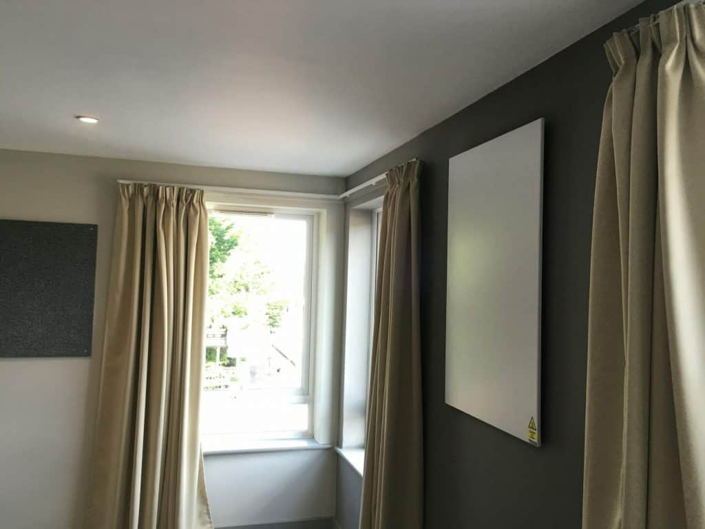 Wall or ceiling mounted panels in student rooms