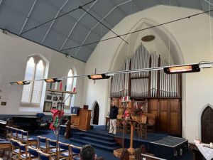 Herschel Colorado heaters suspended from ceiling in Herne bay church