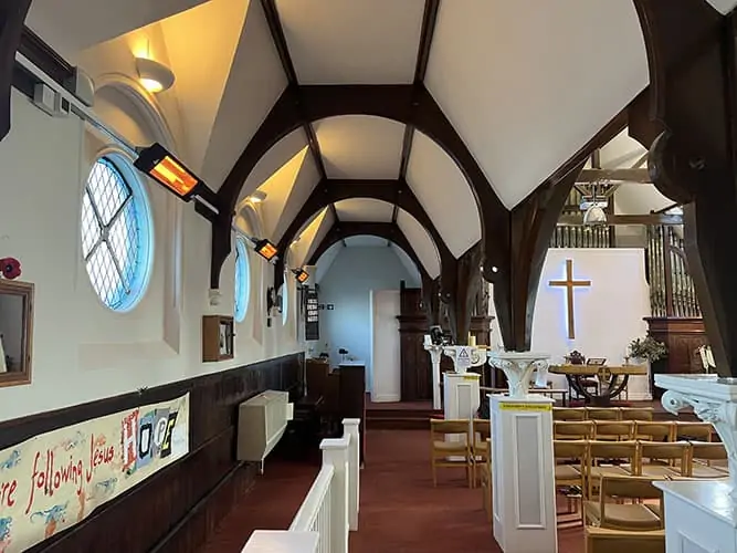 Herschel Colorado heaters suspended from ceiling in Herne bay church