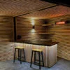 California black electric patio heater installed in a home bar