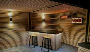 California black electric patio heater installed in a home bar