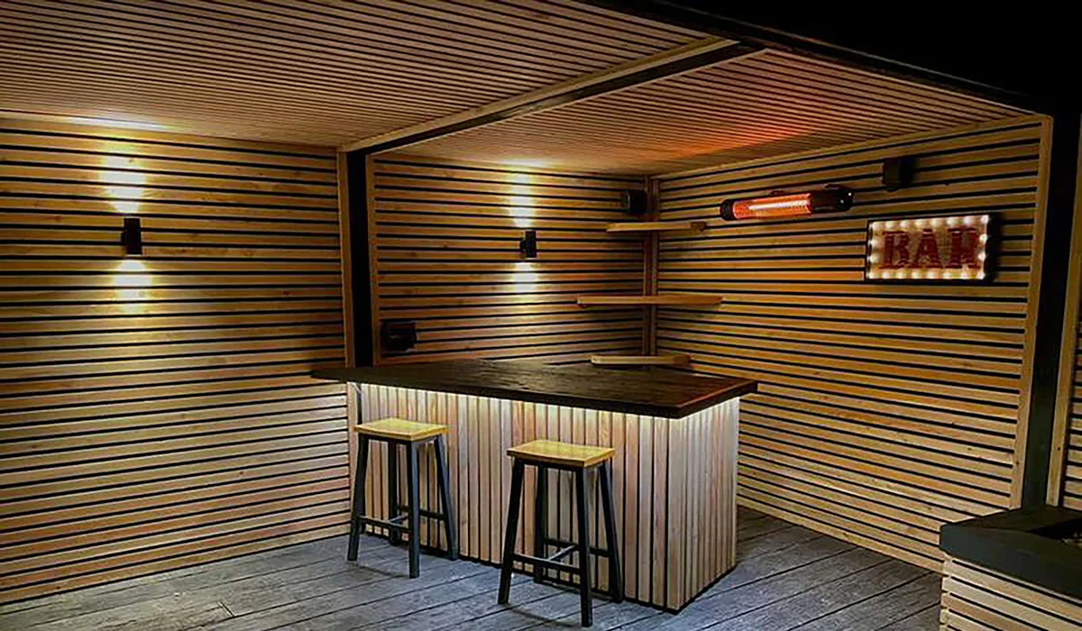 California black electric patio heater installed in a home bar