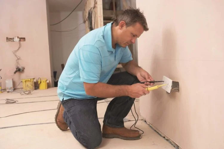 Electrician Installing Wall Socket
