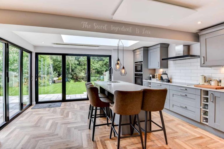 Herschel Select XLS and Inspire panel heaters in a modern kitchen dining area