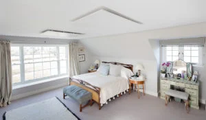 Ceiling mounted infrared heating panels in bedroom