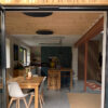 Herschel Grey Round Panels installed on ceiling with White Panels in modern home extension