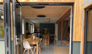 Herschel Grey Round Panels installed on ceiling with White Panels in modern home extension