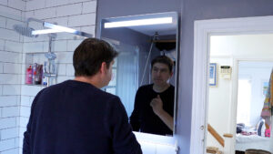 Select XLS Mirror with lights installed in bathroom