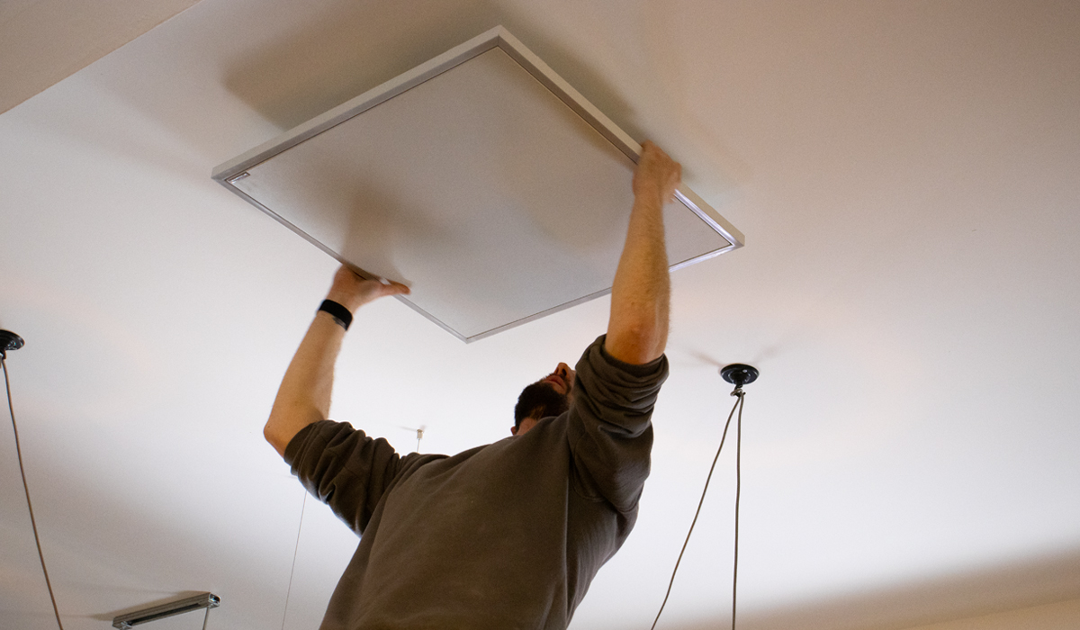 Herschel Infrared panel heater being installed on ceiling